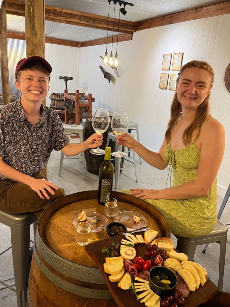 Two guests enjoying an elevated tasting with wine and charcuterie at Adam Puchta Winery