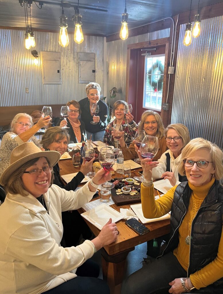 Group of guests raising wine glasses during an elevated tasting at Adam Puchta Winery